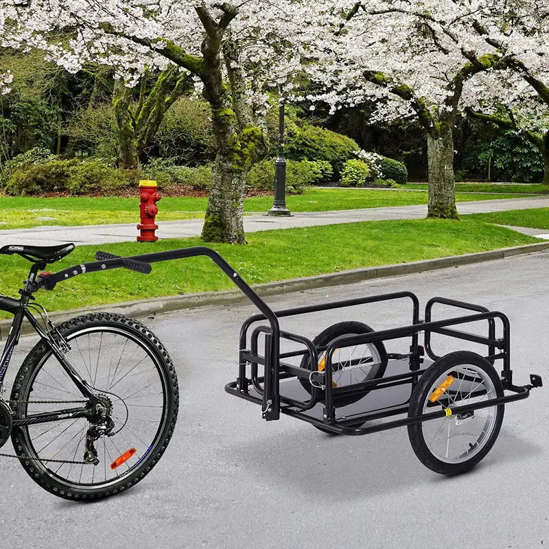 Zijaanzicht van de opvouwbare fietskar met luchtbanden