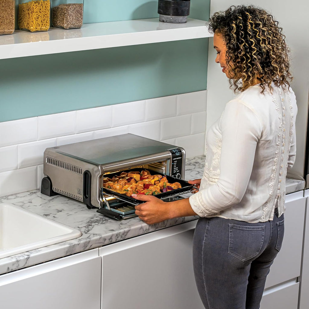 Ninja Foodi Four Multifonctions 8-en-1, Mini four portable, surfaces de travail, four multifonctions avec 8 fonctions de cuisson ; Air Fry, R?tir, Griller, Cuire et plus encore. Argent/Noir SP101EU