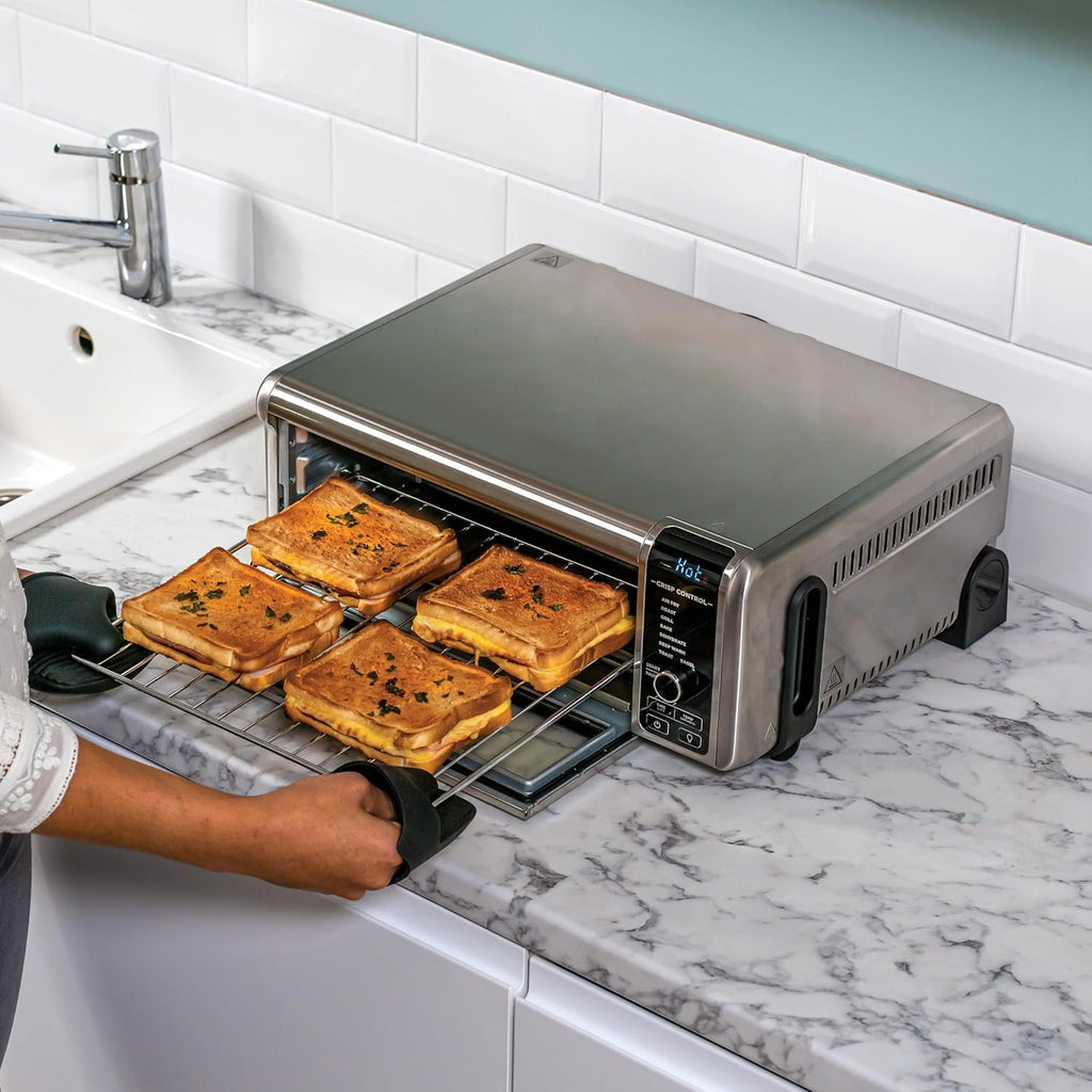 Ninja Foodi Four Multifonctions 8-en-1, Mini four portable, surfaces de travail, four multifonctions avec 8 fonctions de cuisson ; Air Fry, R?tir, Griller, Cuire et plus encore. Argent/Noir SP101EU